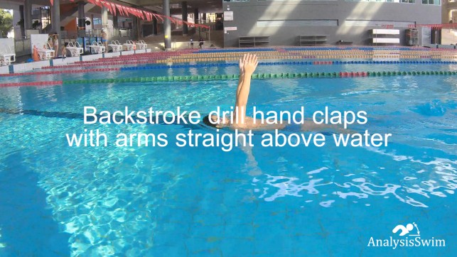 Backstroke drill hand claps with arms straight above water