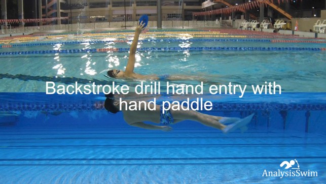 Backstroke drill hand entry with hand paddle