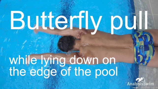 Butterfly pull while lying down on the edge of the pool