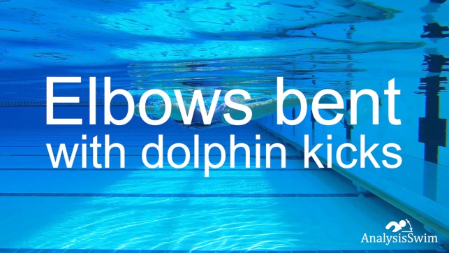 Elbows bent with dolphin kicks