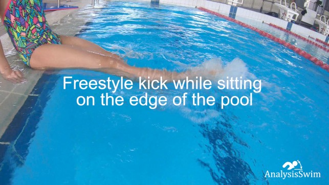 Freestyle kick while sitting on the edge of the pool