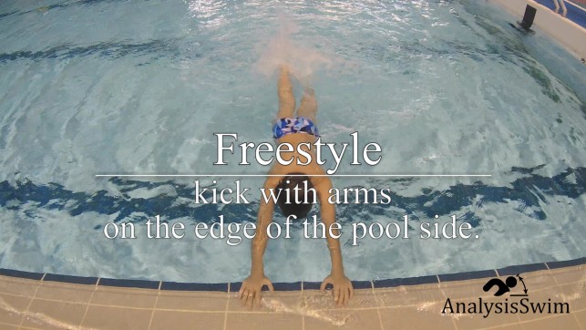 Freestyle kick with arms on the edge of the pool side